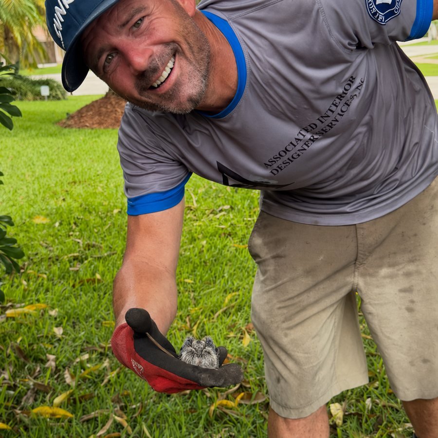 SoFlo Lawn Pros crew member on the job